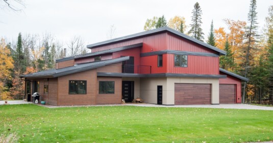 Klauer Steel Siding on a three-story home in a brown color.