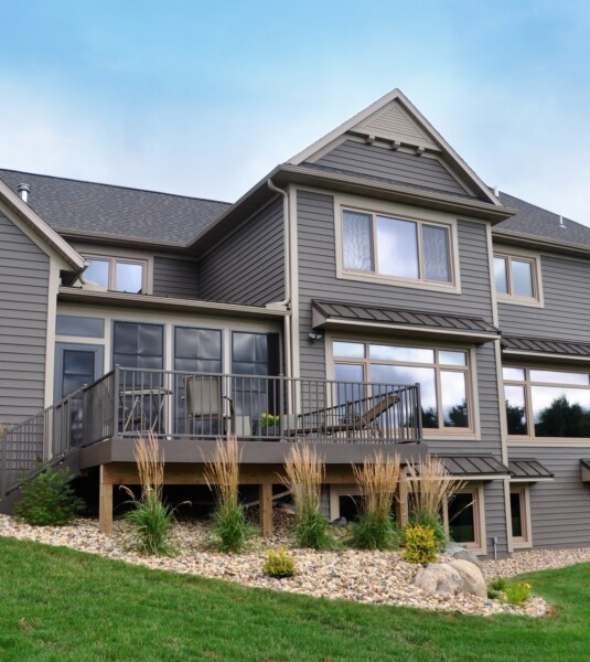 Klauer Steel Siding on a three-story home in a brown color.